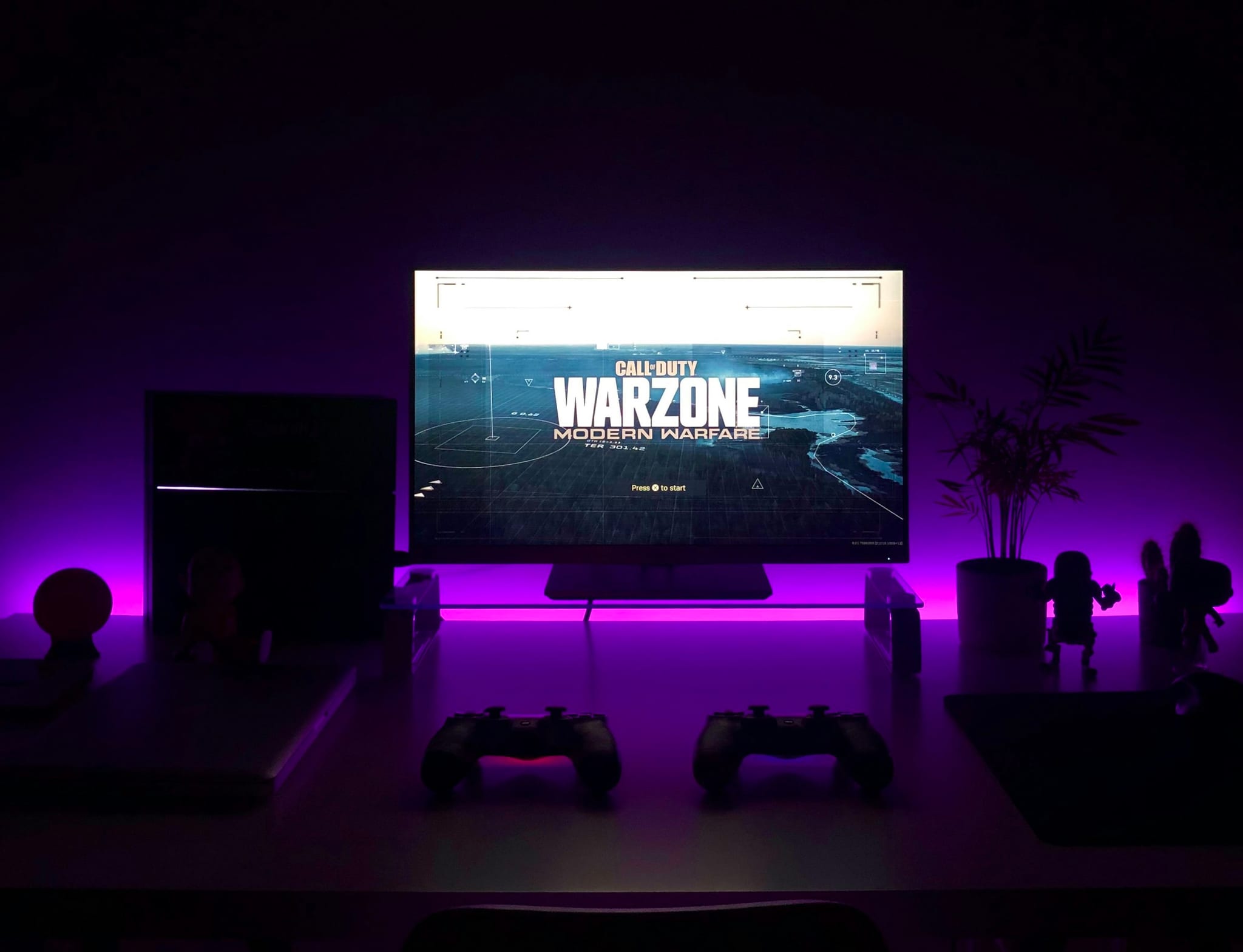 Immersive gaming atmosphere, player in dark cinematic setup with neon lighting